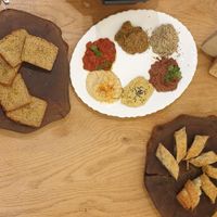 Dips gluten free bread at DaOrganic restaurant in Sofia