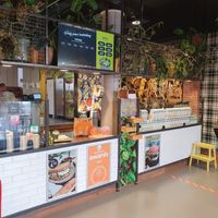 The Fresh Factory indoor with one of the two  order and pay touch screens. You also see the screen with your number when it is prepared and when it is ready. at The Fresh Factory in Nijmegen