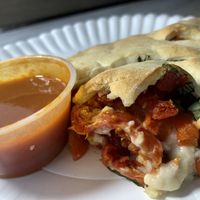 Vegan calzone with bee hive cheese and veggies  at Manicomio Pizza & Food in Asheville