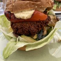 Stacked roast veggie and falafel burger with hummus and sweet relish sauce    at MQ Daily in Vienna