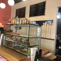 Baked goods display and menu at Glow Plant Based Revolution in New York City