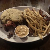 Not a good picture but SO good! Jackfruit Rueben Sandwich with GF/Vegan bun, sweet potato and shoestring fries, vegan southwest sauce    at Lucky's Taproom and Eatery in Dayton