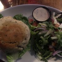 Bean burger on a gluten free bun with side salad and vegan ranch at Lucky's Taproom and Eatery in Dayton