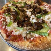Make your own pizza! Jerk tempeh with green peppers and mushrooms  at Mellow Mushroom in Wilmington