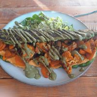 Mung bean omelette stuffed with hummus, roasted cauliflower and sweet potato at Earthlings in Newcastle Upon Tyne