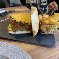 Burger with side of chips  at Chef N Fire in Helensvale
