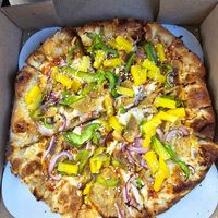 Thai Chicken - Kikkoman Thai chile sauce, vegan garlic mozzarella, vegan chicken, pineapple, red onion, green peppers, sesame seeds at Pizza Uncommon in West Lafayette