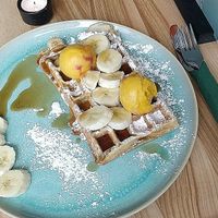 Warm waffle with fruit, maple syrup & Luicella's ice cream at Good One Café in Hamburg