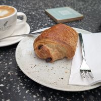 Flat white and Chocolate croissant at Good One Café in Hamburg