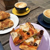 Nougat and marzipan croissant and pizza with mozzarella, olives, ham and peppers  at Schwarzbrot OG in Vienna