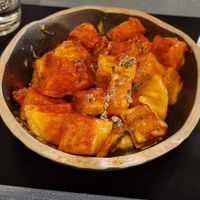 Creamy patatas bravas with homemade smoked chipotle sauce at Copenhagen in Valencia