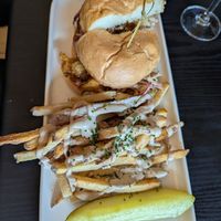 Artichoke Po' Boi sandwich with the amazing creamy sauce and truffle powder on the fries! at Gladys  in Edgewater