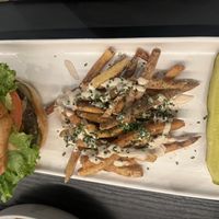 The “Lucky”: Savory, breaded & fried lion’s mane mushrooms, glazed with sweet chili sauce & layered between a Bluepoint bun with mayo, pickled cucumbers, shallots  at Gladys  in Edgewater