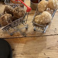 Vegan beef croquettes on the left, and vegan cheese on the right   at Atabalats in Barcelona