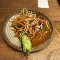 Papaya salad which I already started to eat   at Chompoo in Tokyo
