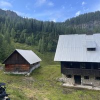 Two of the huts at this location. A restaurant hut and additional huts for accommodations.  at Krekova koča na Ratitovcu in Torka