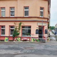 outside (not the cleanest district tbh) at Café Lux in Leipzig