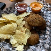 Nuggets w cheese sauce (chips included w burger) at La Selvita in Merida