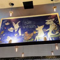 Gorgeous mural way up high at Bar Vegan in Albany