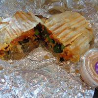 Southwest Breakfast Burrito. Tofu scramble, plant cheddar, roasted tomato, fresh jalapenos, roasted home fries, black bean and corn salsa in a tortilla with a side of spicy cashew ranch. Generous portion and medley of flavors. Might be a new fave!!!
 at Evexia in Aurora