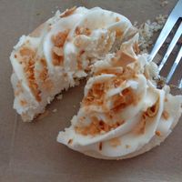 Gourmet Sugar Cookie (GF/V)- sugar cookie with toasted coconut, half-eaten. Yum! at Evexia in Aurora