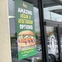 Outdoor signage promoting vegetarian and vegan sandwich options   at Ike's in Carson