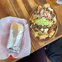 Asada burrito & Al pastor nachos 👌🏼   at Mis Tacones in Portland