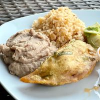 Soyrizo Empanada side of beans & rice  at Mis Tacones in Portland