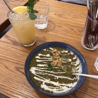 Spinach soup with house made lemonade   at Dosa Dosa in Prague
