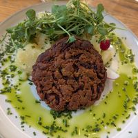 Beetroot tofu patty with Viennese potato salad at Dosa Dosa in Prague