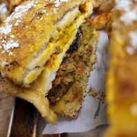 Jambi chicken breakfast sando with fried vegan egg and plantain bacon at Eris Food Co in Oceanside