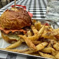Burger on pretzel bun w/salt & vinegar fries  at Eris Food Co in Oceanside