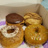 Four big ol' doughnuts at Bun and Coffee in Malaga