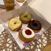 Passion fruit (yellow one), strawberries&cream, pistachio (green) and chocolate& raspberry at Bun and Coffee in Malaga