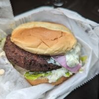 Vegan Crab cake sandwich with NuVegan sauce lettuce tomato and a Very soft bun at NuVegan in Baltimore