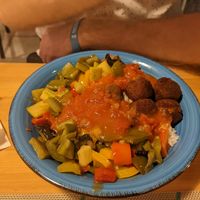 Vegan meal with rice, falafel, vegetables and tomato sauce at Green Planet the Foodcourt in Gran Canaria