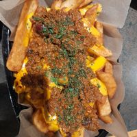 Vego Fries, beer battered, plant ragu and cheezy sauce at Shoreline Hotel in Howrah