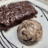 Brownie with ice cream  at Parada Vegana in Cusco