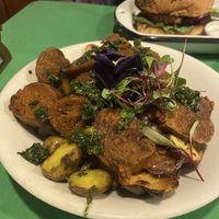 Fries & sausage starter   at Parada Vegana in Cusco