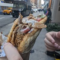 Gyros sandwich!! Options on the ordering system to add more but it's just the meat, sauce, tomatoes and lettuce. at Vegan On The Fly in New York City