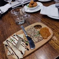 Camembert cheeseplate and fried, stuffed olives in the back at Funghi E Tartufo in Melbourne