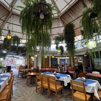 Seating is under this leafy dome area, a cool space  at Las Chinitas in Panajachel
