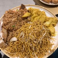 Chow mein soft noodles (front), vegan special fried rice (back left), vegan chicken satay (back right)  at Vegan Green Kitchen in Manchester