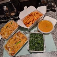 A duck and a chicken chow mein, crispy seaweed, salt and pepper chips, satay sauce at Vegan Green Kitchen in Manchester
