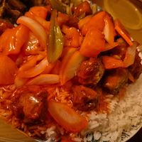 sweet and sour chicken and boiled rice at Vegan Green Kitchen in Manchester