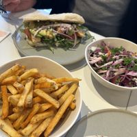 Grilled chick’s & basil pesto, seasoned fries and slaw  at Neat - Victoria in South West London