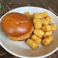 Chick’n sandwich with tater tots.   at Neat - Victoria in South West London