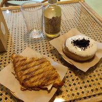 Ham and cheese croissant, Oreo doughnut and kombucha at Areca Bakery in Barcelona