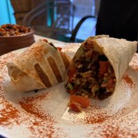 Burrito with a side of rice and beans, all well seasoned   at El Burro Tacos y Tequila in Athens