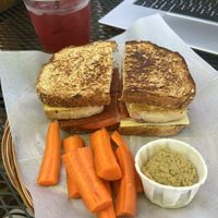 Tropical iced tea, BBQ tofu sandwich, and a side of carrot sticks and hummus    at Grilla Bites in Snohomish